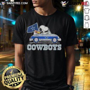 Official 2025 Snoopy and Woodstock Car Logo Cowboys T-Shirt featuring vibrant graphics and a stylish design for fans.