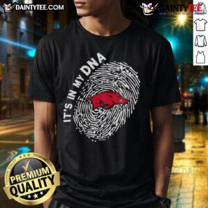 Official Arkansas Razorbacks In My DNA T-Shirt featuring bold team logo, perfect for fans and game day attire.