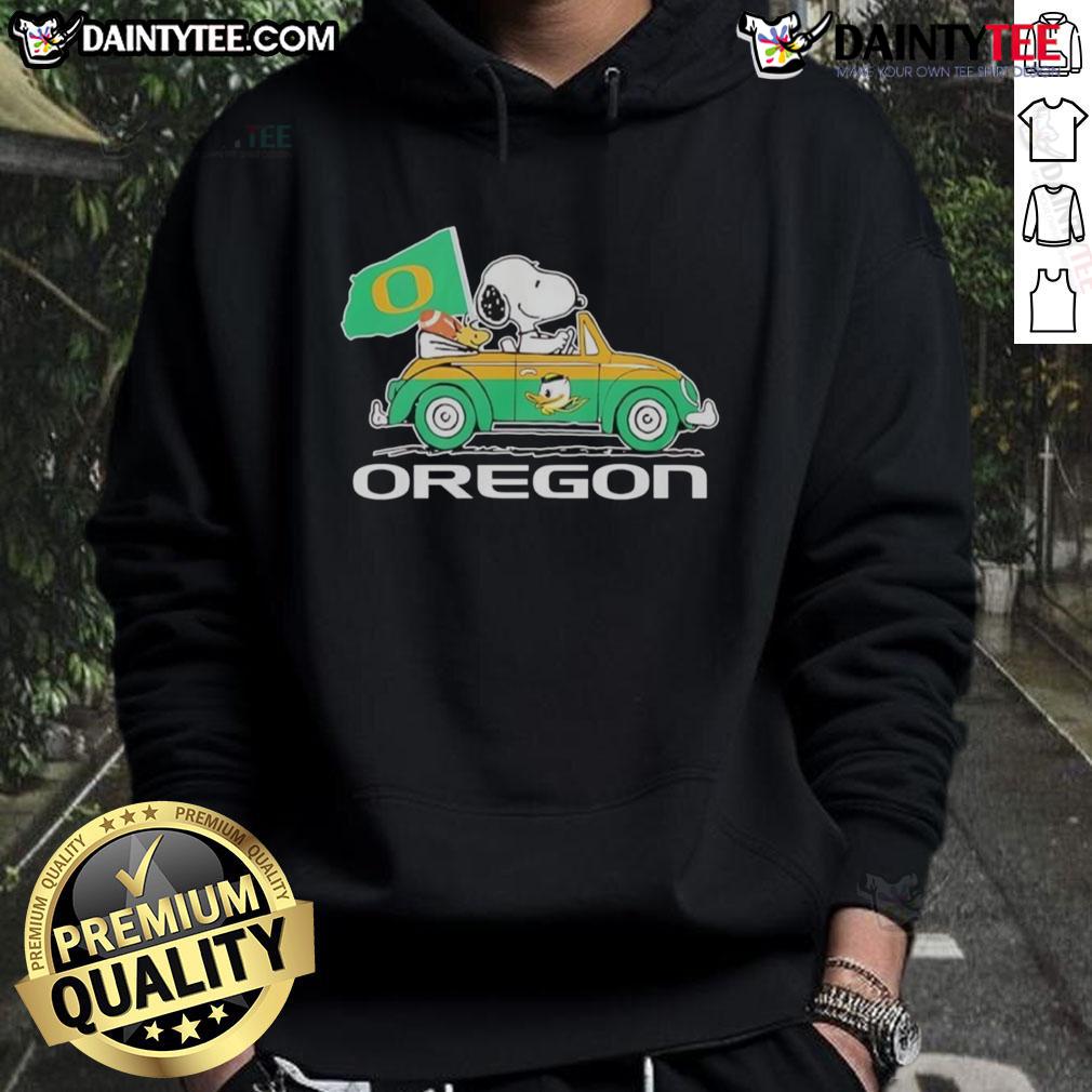 Alt Text: Official Oregon Ducks X Snoopy hoodie featuring Woodstock driving a car, perfect for fans and cozy style.