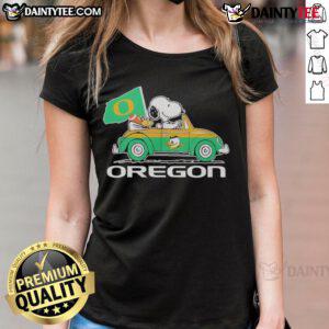 Official Oregon Ducks x Snoopy with Woodstock driving a car on a ladies tee shirt, perfect for fans and collectors.