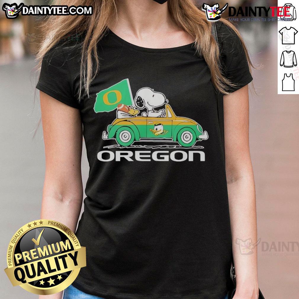 Official Oregon Ducks x Snoopy with Woodstock driving a car on a ladies tee shirt, perfect for fans and collectors.