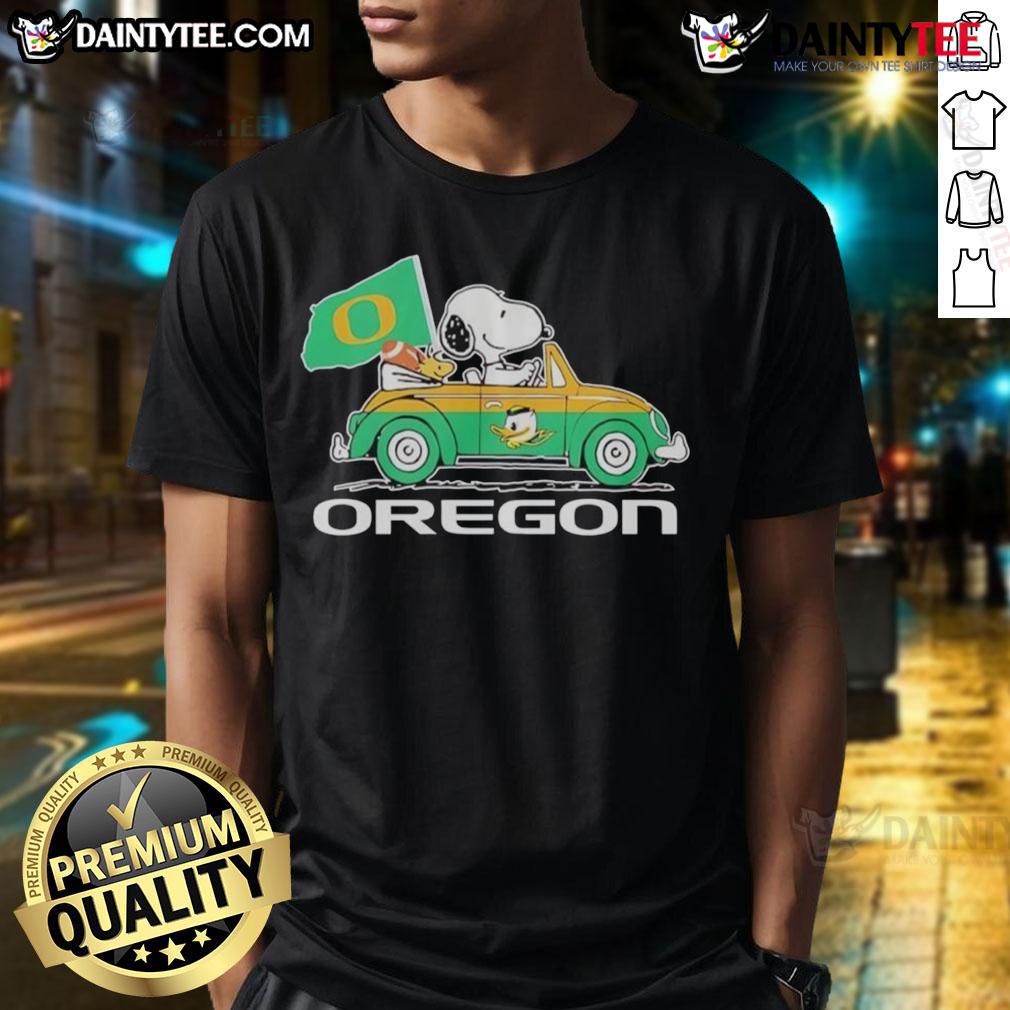 Official Oregon Ducks X Snoopy and Woodstock driving a car graphic t-shirt for fans and collectors.