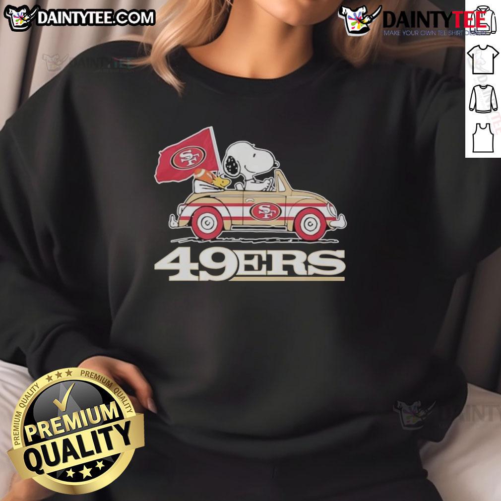 Alt Text: Official San Francisco 49ers x Snoopy sweatshirt featuring Woodstock driving a car in team colors.