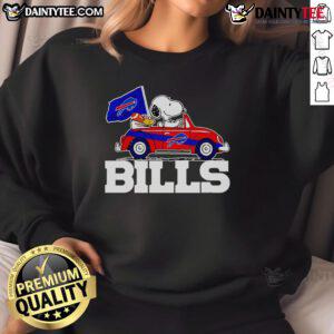 Official Snoopy and Woodstock driving car on Buffalo Bills sweatshirt design, perfect for fans and cozy wear.