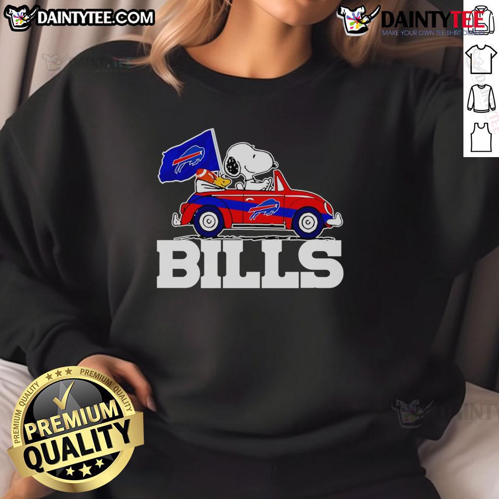 Official Snoopy and Woodstock driving car on Buffalo Bills sweatshirt design, perfect for fans and cozy wear.