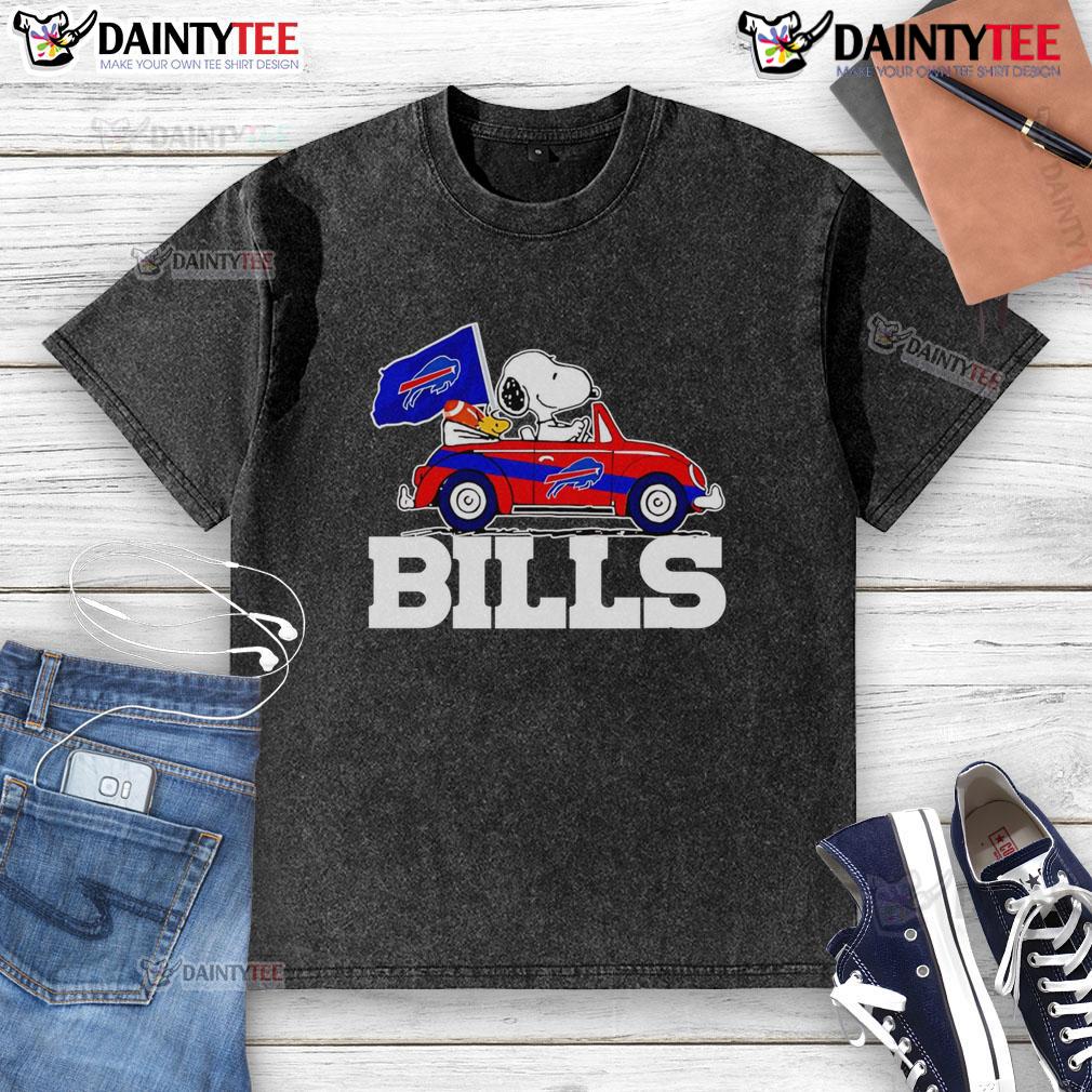 Alt Text: Official Snoopy and Woodstock driving a car on Buffalo Bills washed t-shirt, perfect for fans and collectors.