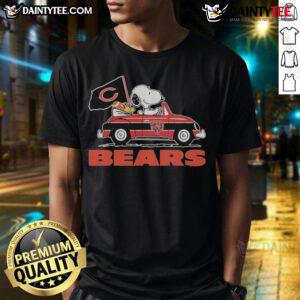 Official Snoopy and Woodstock driving a car on a Chicago Bears T-Shirt, showcasing team spirit and playful design.