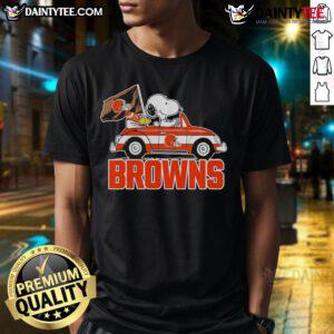 Official Snoopy and Woodstock driving a car on Cleveland Browns T-Shirt, perfect for fans and collectors.