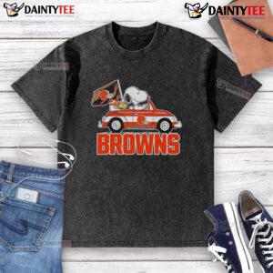 Alt Text: Official Snoopy and Woodstock driving a car on a Cleveland Browns washed t-shirt, perfect for fans and casual wear.