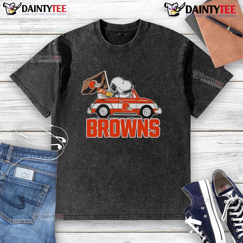 Alt Text: Official Snoopy and Woodstock driving a car on a Cleveland Browns washed t-shirt, perfect for fans and casual wear.