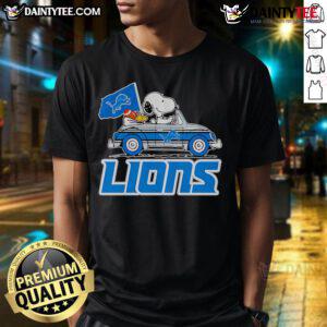 Alt Text: Official Snoopy and Woodstock driving car Detroit Lions T-Shirt, featuring iconic characters in team colors.