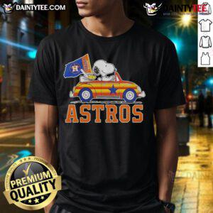 Official Snoopy and Woodstock driving car Houston Astros T-Shirt, featuring vibrant graphics and team colors for fans.