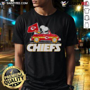 Official Snoopy and Woodstock driving a car on Kansas City Chiefs T-Shirt design for fans and collectors.