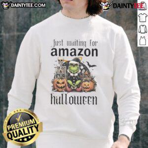 Alt Text: Awesome Grinch Halloween sweatshirt ready for Amazon shoppers, featuring festive design perfect for spooky season.