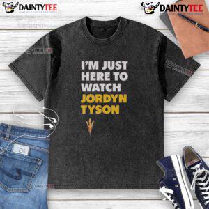 Alt Text: Awesome Jordyn Tyson wearing 'I'm Just Here To Watch' washed t-shirt, showcasing casual style and trendy fashion.