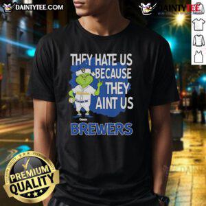 Alt Text: Awesome Milwaukee Brewers Grinch Christmas T-Shirt featuring They Hate Us Ain't Us design in festive colors.