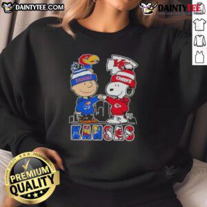 Awesome Snoopy X Charlie Brown Kansas Sports Jayhawks X Chiefs skyline sweatshirt featuring vibrant graphics and cozy design.