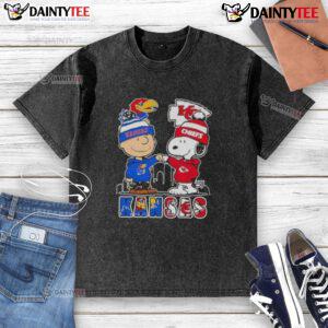 Alt Text: Awesome Snoopy X Charlie Brown Kansas Sports Jayhawks X Chiefs Skyline Washed T-Shirt design featuring iconic characters.