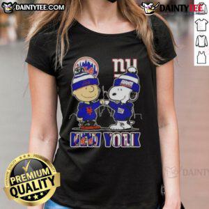 Awesome Snoopy x Charlie Brown New York Mets x Giants skyline ladies tee featuring iconic characters and cityscape.