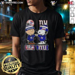 Alt Text: Awesome Snoopy X Charlie Brown New York Sports Yankees X Giants Skyline T-Shirt featuring iconic characters and city skyline.
