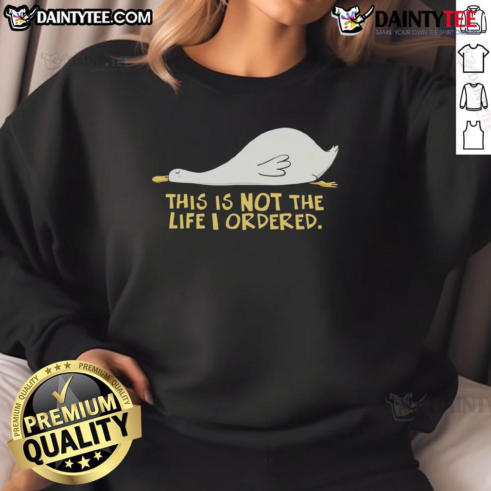 Alt Text: Cute duck on a sweatshirt with the phrase This Is Not The Life I Ordered in playful typography.
