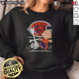 Alt Text: Cute Peanuts Snoopy and Charlie Brown Chicago Bears football sweatshirt, perfect for fans of the Peanuts gang.