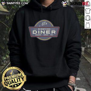 Alt Text: Funny AI wearing a hoodie enjoying breakfast burgers and fries at a downtown diner, perfect for food lovers.