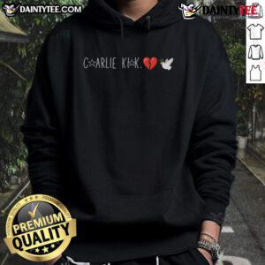 Happy Charlie Kirk wearing a dove hoodie with a broken heart design, showcasing a positive vibe and unique style.