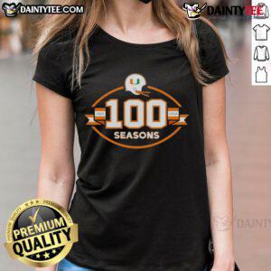 Happy Miami Hurricanes Football 100 Seasons 1926-2025 Ladies Tee featuring vibrant team colors and logo.