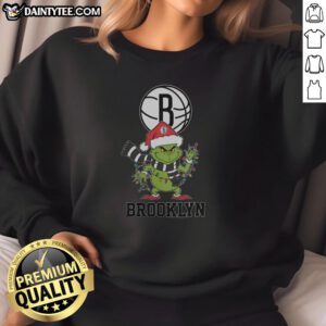 Brooklyn Nets Christmas sweatshirt featuring a Grinch and Santa hat design, perfect for the 2025 holiday season.