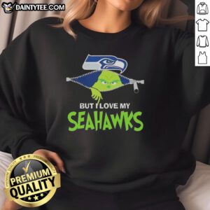 Awesome Grinch sweatshirt featuring Seattle Seahawks logo, perfect for football fans celebrating the holiday season.
