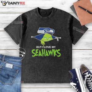 Awesome Grinch graphic on a washed Seattle Seahawks football t-shirt, perfect for fans showing team spirit.