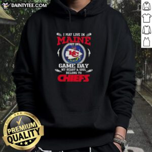 Person wearing a Kansas City Chiefs hoodie, showcasing team pride on game day in Maine, highlighting football fandom.