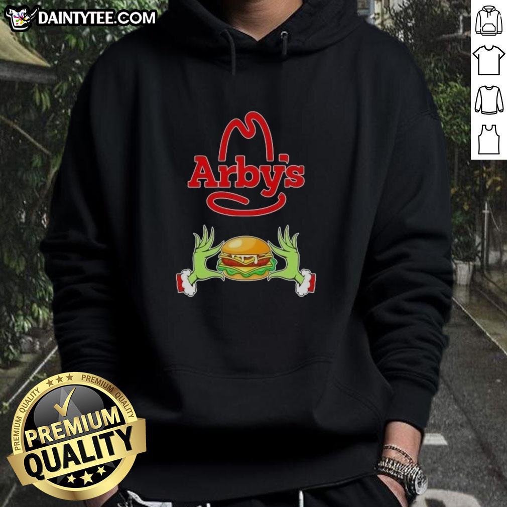 Good Grinch hands holding an Arby's cup, wearing a Merry Christmas hoodie for festive holiday cheer.