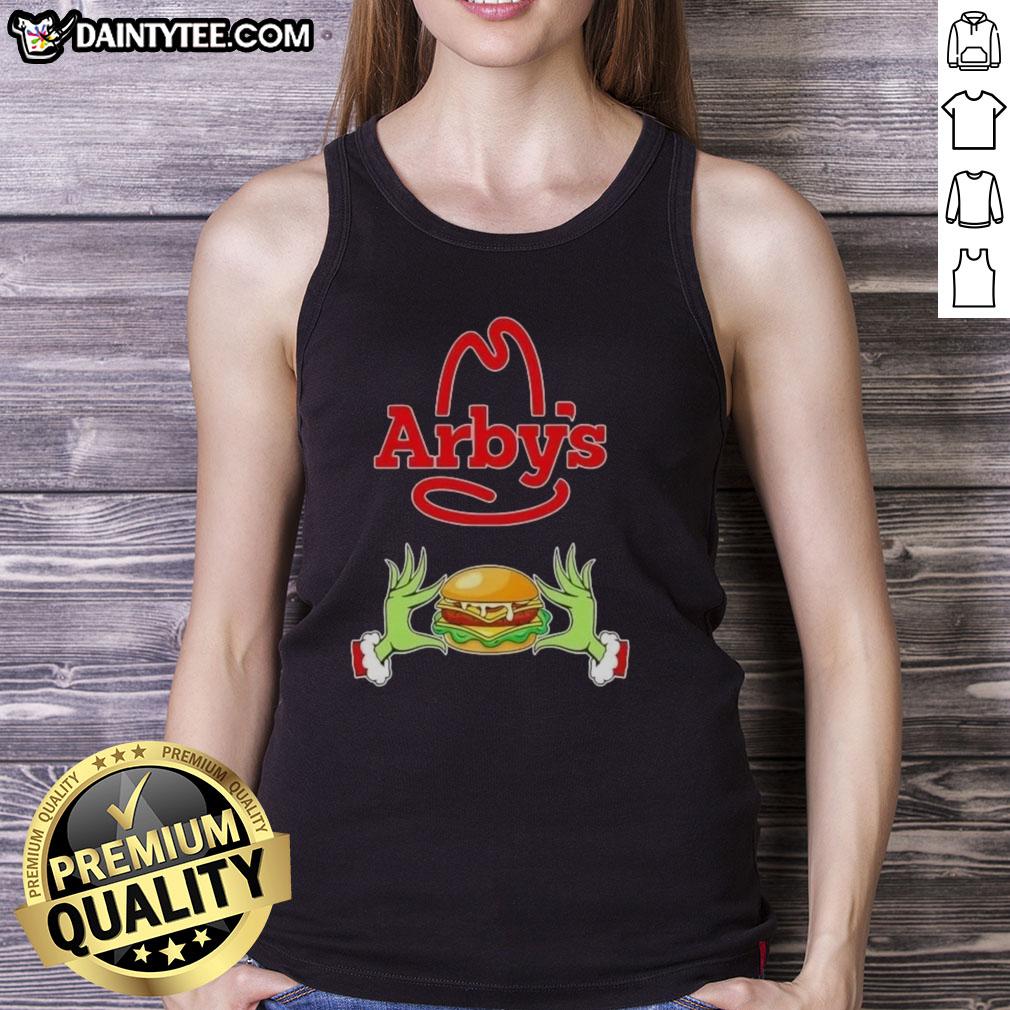 Good Grinch hands holding an Arby's cup, wearing a Merry Christmas tank top, perfect for holiday festivities.