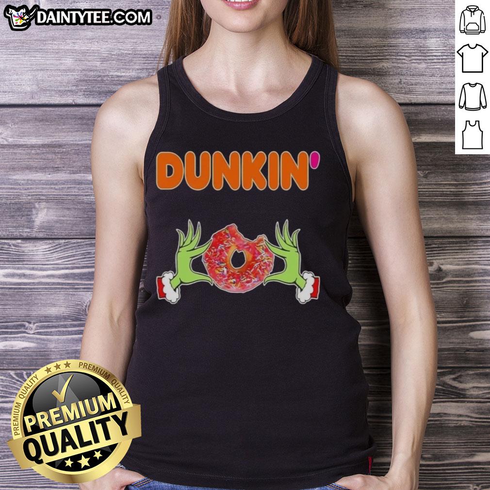 Good Grinch hands holding a Dunkin' Donut in a Merry Christmas tank top, perfect for holiday festivities.