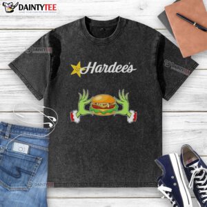 Good Grinch hands on a washed t-shirt, showcasing love for Hardee's this Merry Christmas in a festive design.