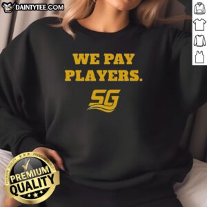 Alt Text: Happy Chad Powers wearing a We Pay Players sweatshirt while coaching with Coach Byrd, showcasing team spirit and style.