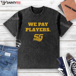Happy Chad Powers wearing 'We Pay Players' washed t-shirt, showcasing stylish coaching vibes and team spirit.