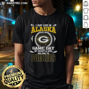 Premium Green Bay Packers T-shirt featuring 'I May Live In Alaska But On Game Day My Heart And Soul Belongs To' design.