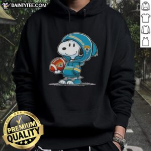 Happy Peanuts Snoopy in a Jacksonville Jaguars hoodie, smiling at fans at a football event.