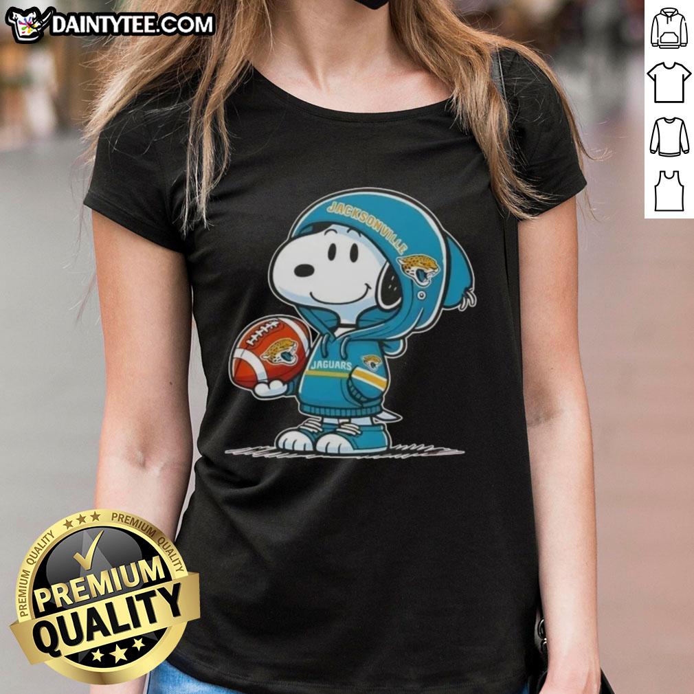 Happy Peanuts Snoopy wearing Jacksonville Jaguars hoodie, smiling at fans on ladies tee design.