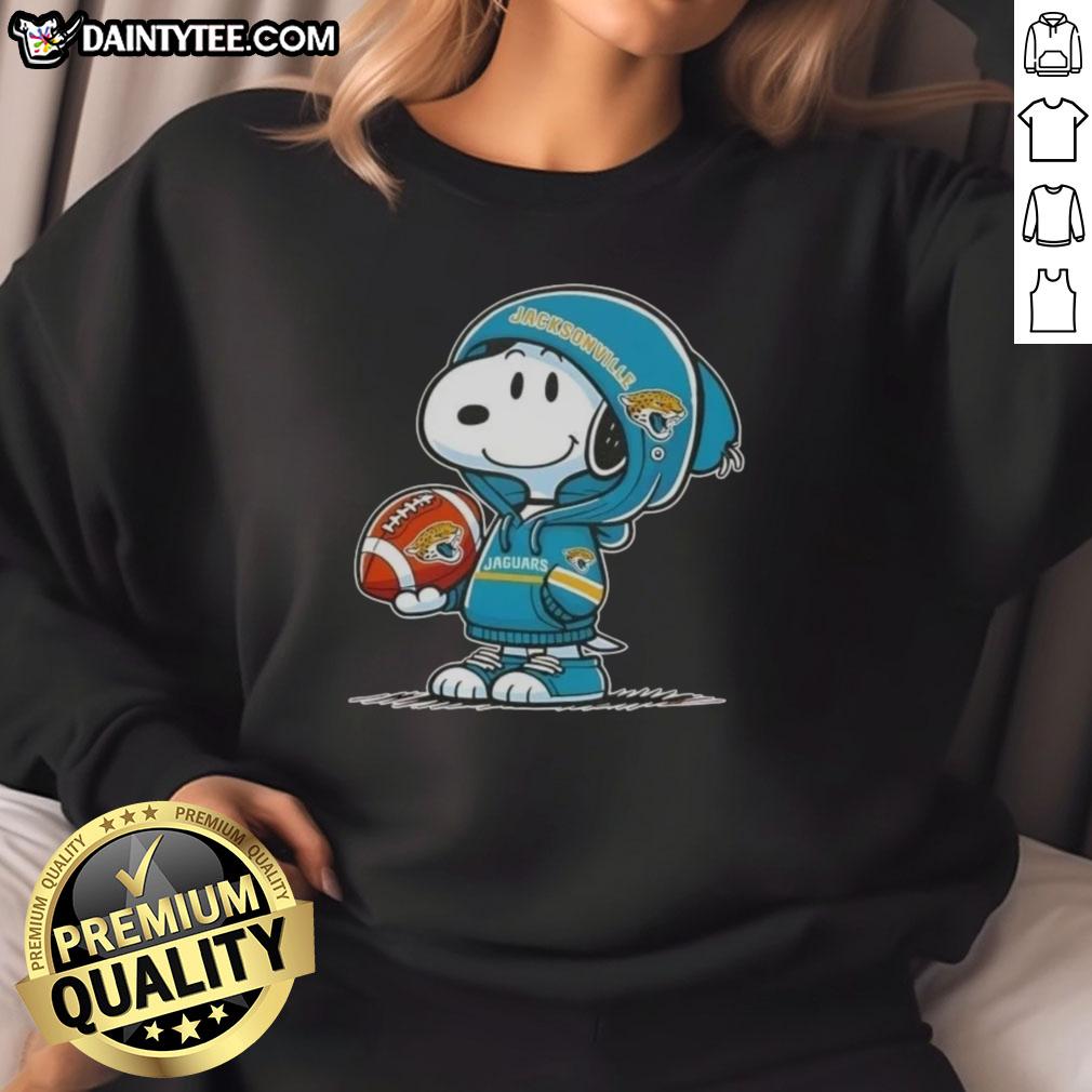 Happy Peanuts Snoopy in a hoodie, smiling at fans while wearing Jacksonville Jaguars sweatshirt.