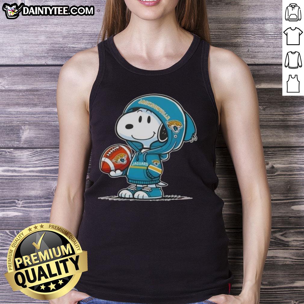 Alt Text: Happy Peanuts Snoopy in a Jacksonville Jaguars hoodie smiles at fans while wearing a tank top, showcasing team spirit.