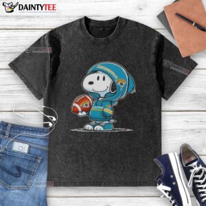 Happy Peanuts Snoopy wearing Jacksonville Jaguars hoodie, smiling at fans, showcasing a washed t-shirt design.
