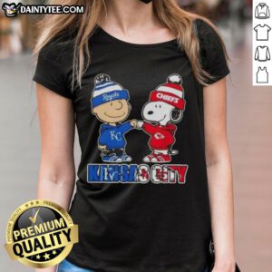 Awesome Charlie Brown and Snoopy fist bump in Kansas City sports tee for Royals and Chiefs fans, perfect for ladies.