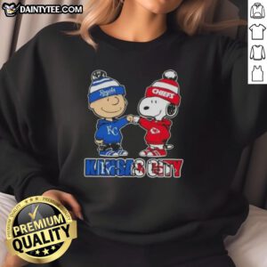 Alt Text: Awesome Charlie Brown fist bump with Snoopy on Kansas City sports sweatshirt for Royals and Chiefs fans.