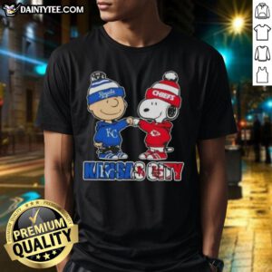 Alt Text: Awesome Charlie Brown fist bump with Snoopy on a Kansas City Sports Royals X Chiefs T-shirt design.