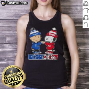 Awesome Charlie Brown fist bump with Snoopy, perfect tank top for Kansas City sports fans supporting Royals and Chiefs.