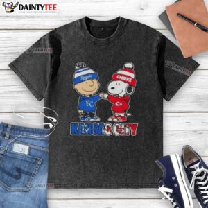 Awesome Charlie Brown fist bump with Snoopy on a Kansas City Royals & Chiefs washed t-shirt design.